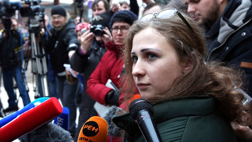 Maria Alyokhina (C), member of Russian punk band Pussy Riot, speaks to the media after her release from a penal colony in Nizhny Novgorod, Russia, Dec. 23, 2013.