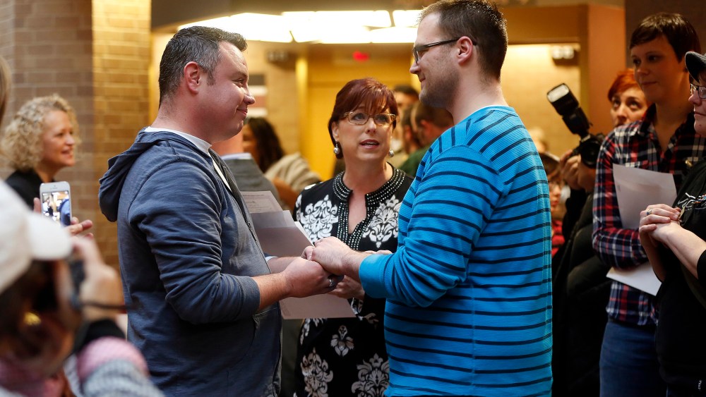 Isaac Troyo and his partner Jed Mecham get married at the Salt Lake County Government Building in Salt Lake City, Utah, Dec. 23, 2013.