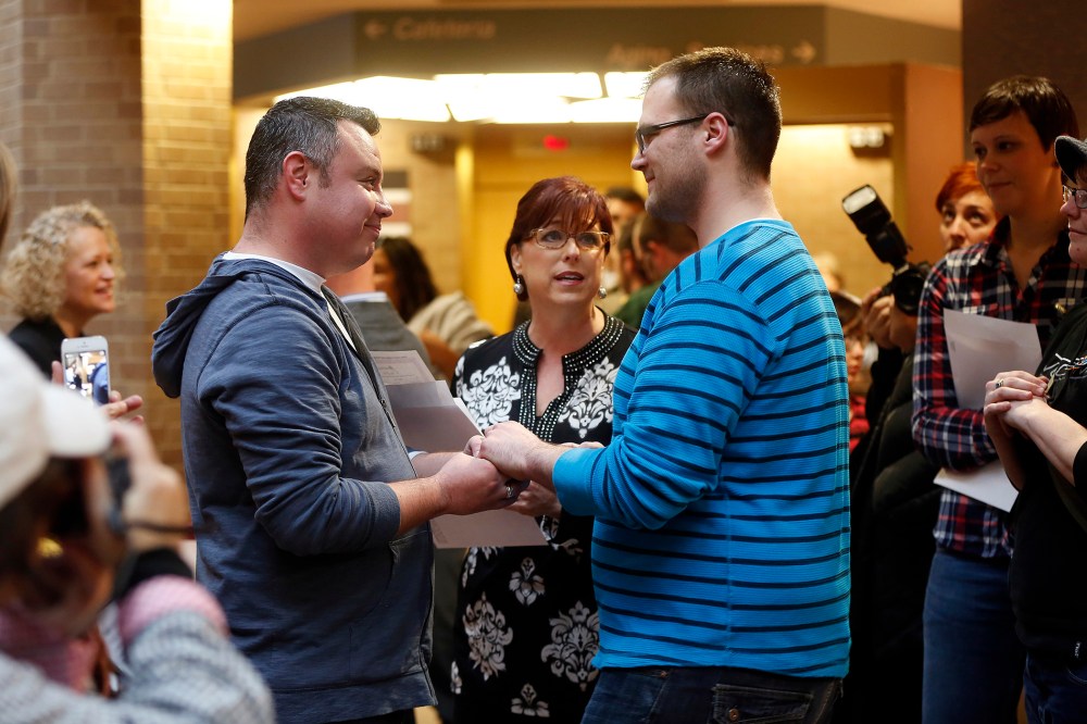 Isaac Troyo and his partner Jed Mecham get married at the Salt Lake County Government Building in Salt Lake City, Utah, Dec. 23, 2013.