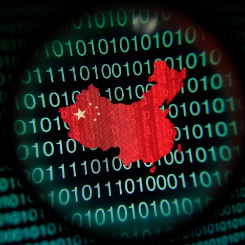 A map of China is seen through a magnifying glass on a computer screen showing binary digits in Singapore in this Jan. 2, 2014 photo illustration. (Photo by Edgar Su/Reuters)