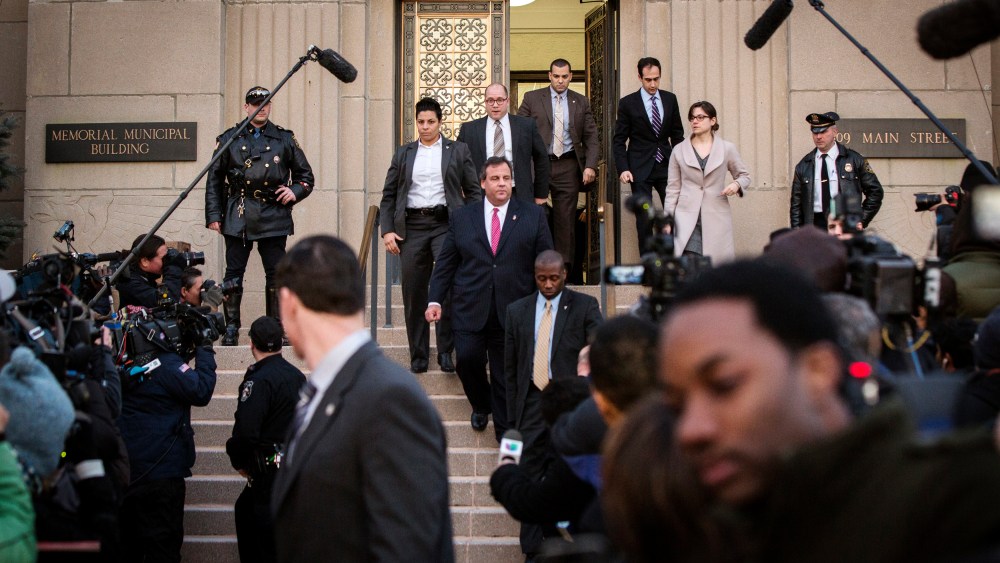 New Jersey Governor Chris Christie (C) departs City Hall in Fort Lee, N.J. on Jan. 9, 2014.