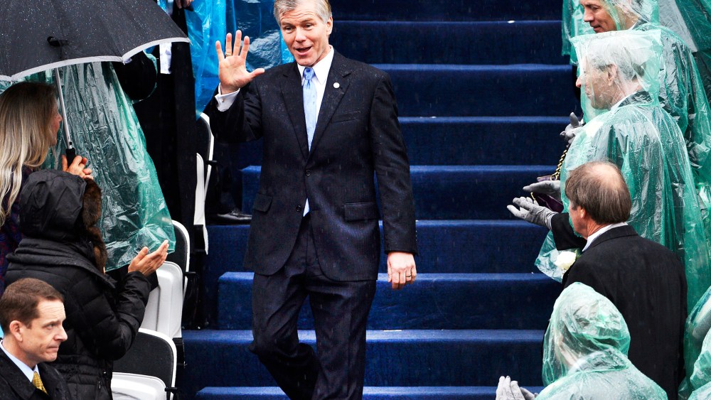 Outgoing Virginia Governor McDonnell waves to guests as he arrives for the swearing-in ceremony of incoming governor McAuliffe in Richmond