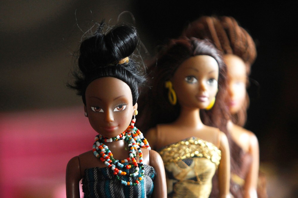 A bead necklace is seen on a doll dressed in local attire, in a workshop in Surulere district, in Nigeria's commercial capital Lagos on Jan. 8, 2014. (Photo by Akintunde Akinleye/Reuters)
