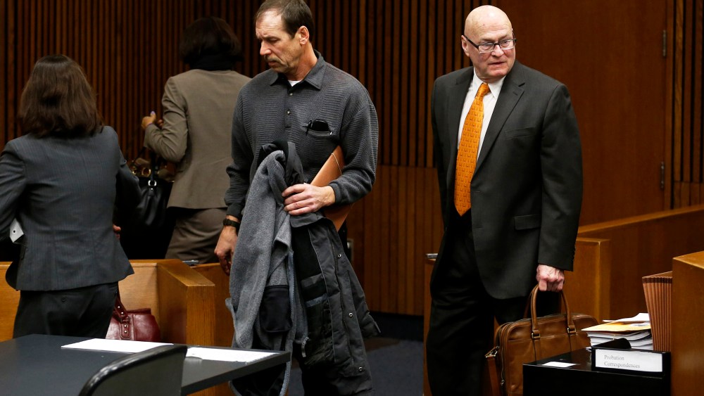 Theodore Wafer (C) and his attorneys Cheryl (L) and Mack Carpenter leave the courtroom after his arraignment in Detroit, Jan. 15, 2014.