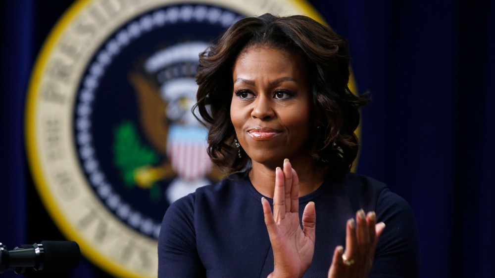 First lady Michelle Obama applauds as she gives remarks during an event, Jan. 16, 2014, in Washington, D.C.