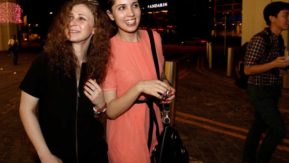 Members of Russian punk rock band Pussy Riot leave the inaugural Prudential Eye Awards in Singapore