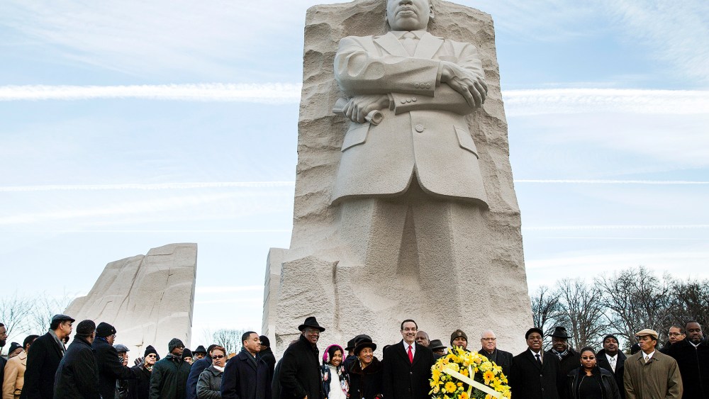 Vincent Gray, mayor of Washington, DC, takes part in a wreath laying ceremony at the Martin Luther King Memorial in Washington, Jan. 20, 2014.