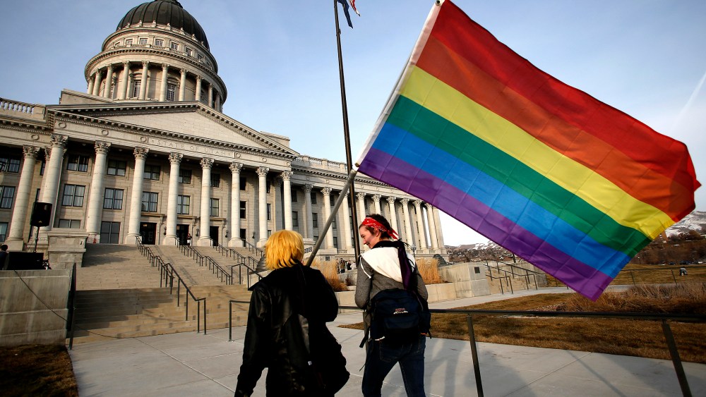 Corbin Aoyagi (L) and Jerusha Cobb walk to join supporters of same-sex marriage rally at Utah's State Capitol building in Salt Lake City, Utah on Jan. 28, 2014.