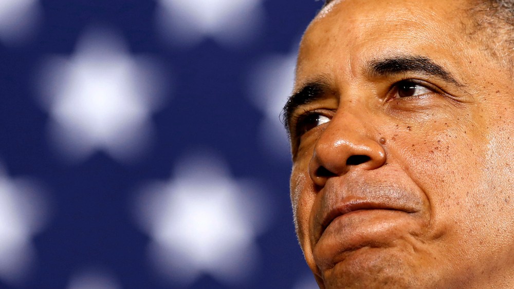 President Barack Obama pauses while he speaks at an event, Jan. 30, 2014 in Waukesha, Wis.