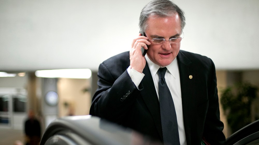 U.S. Senator Pryor talks on his mobile phone as he arrives for the weekly Democratic caucus luncheon at the U.S. Capitol in Washington