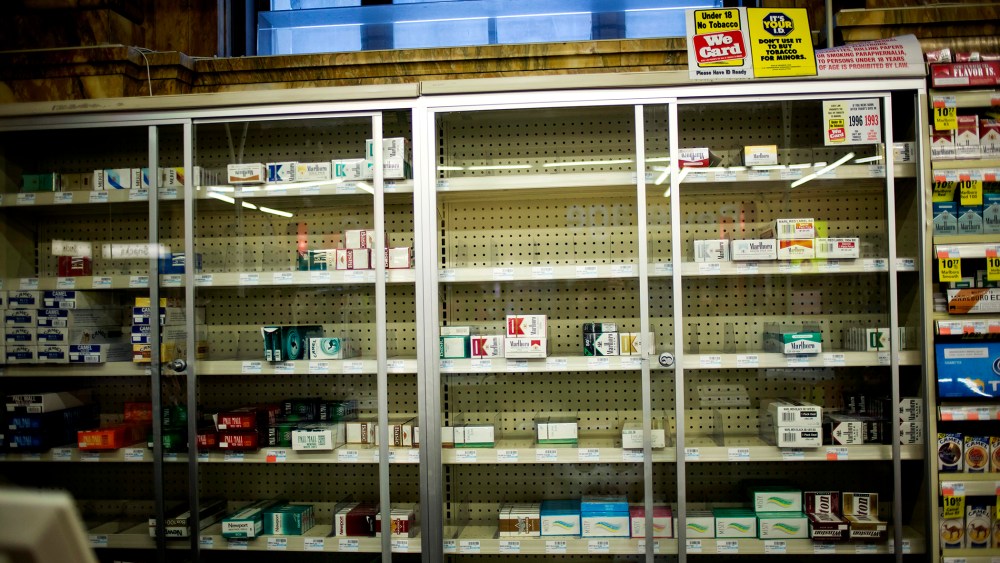 Near empty cigarette shelves are seen at a CVS store in New York February 4, 2014.
