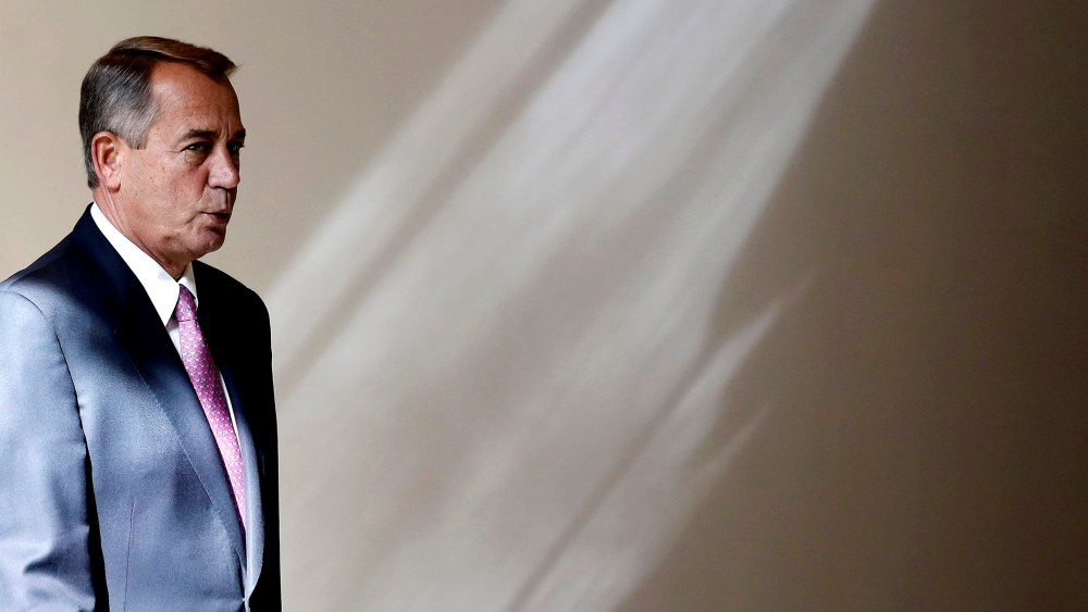 U.S. Speaker of the House John Boehner walks to his weekly news conference on Capitol Hill in Washington, Feb. 6, 2014.