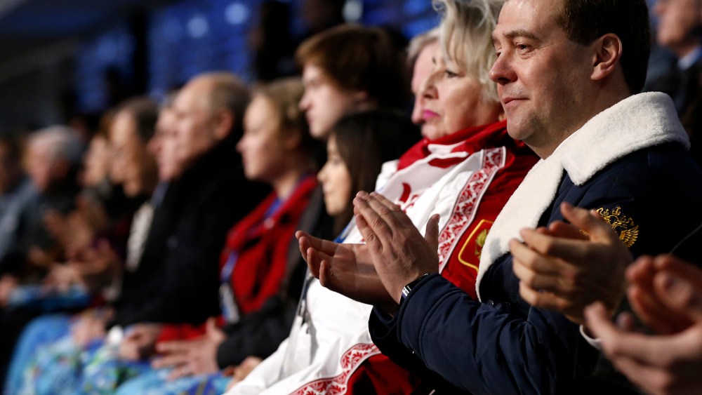 Russia's Prime Minister Dmitry Medvedev (R) attends the opening ceremony of the 2014 Sochi Winter Olympics, Feb. 7, 2014