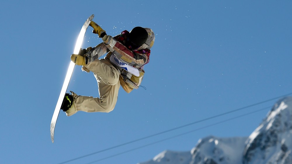 Sage Kotsenburg of the United States performs a jump during the men's snowboard slopestyle final at the 2014 Sochi Olympic Games, Feb. 8, 2014, in Rosa Khutor.