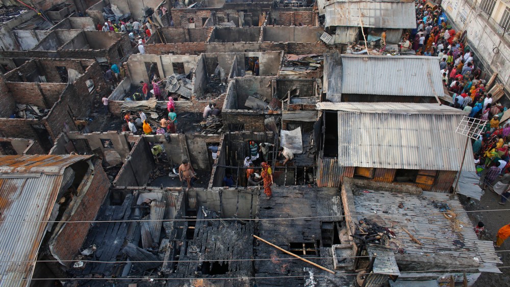 A general view of the wreckage of a slum from the top after a fire broke out, at Mirpur in Dhaka, Bangladesh on Feb. 11, 2014 (Photo by Andrew Biraj/Reuters).