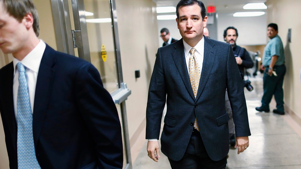Ted Cruz walks to the Senate floor for a vote whether to raise the debt ceiling, Feb. 12, 2014.