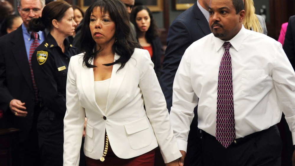 Jordan Davis' mother, Lucia McBath (C) leaves the courtroom with her husband Curtis McBath (R) as court recessed for the jury to reconsider the first charge against Michael Dunn in Jacksonville, Fla., Feb. 15, 2014.