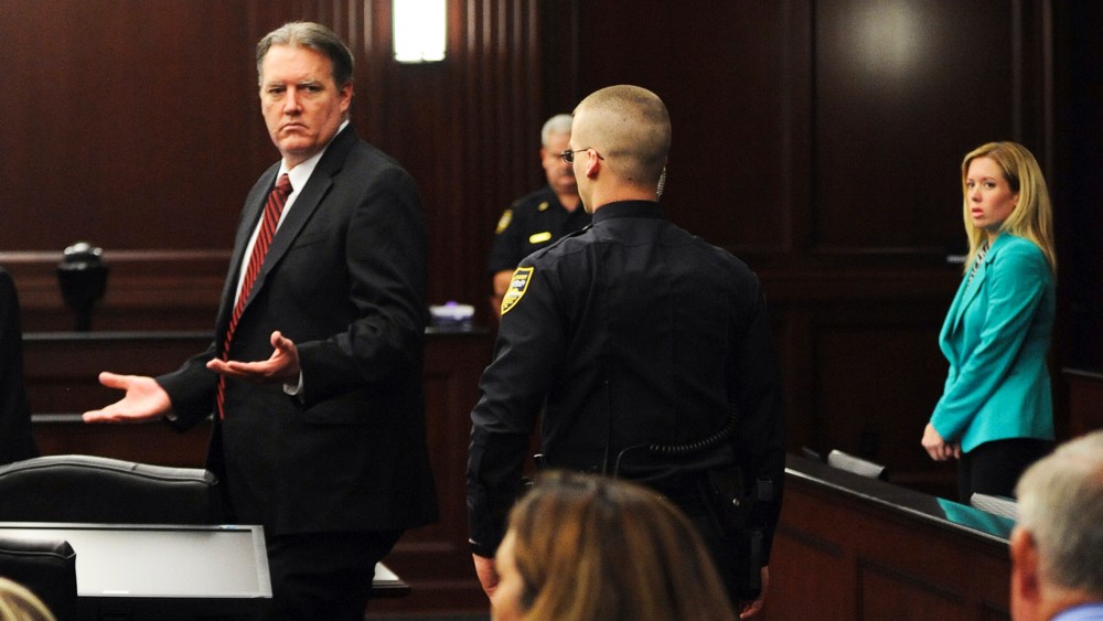 Michael Dunn raises his hands in disbelief as he looks at his parents after the verdicts were announced in his trial in Jacksonville, Florida Feb. 15, 2014.
