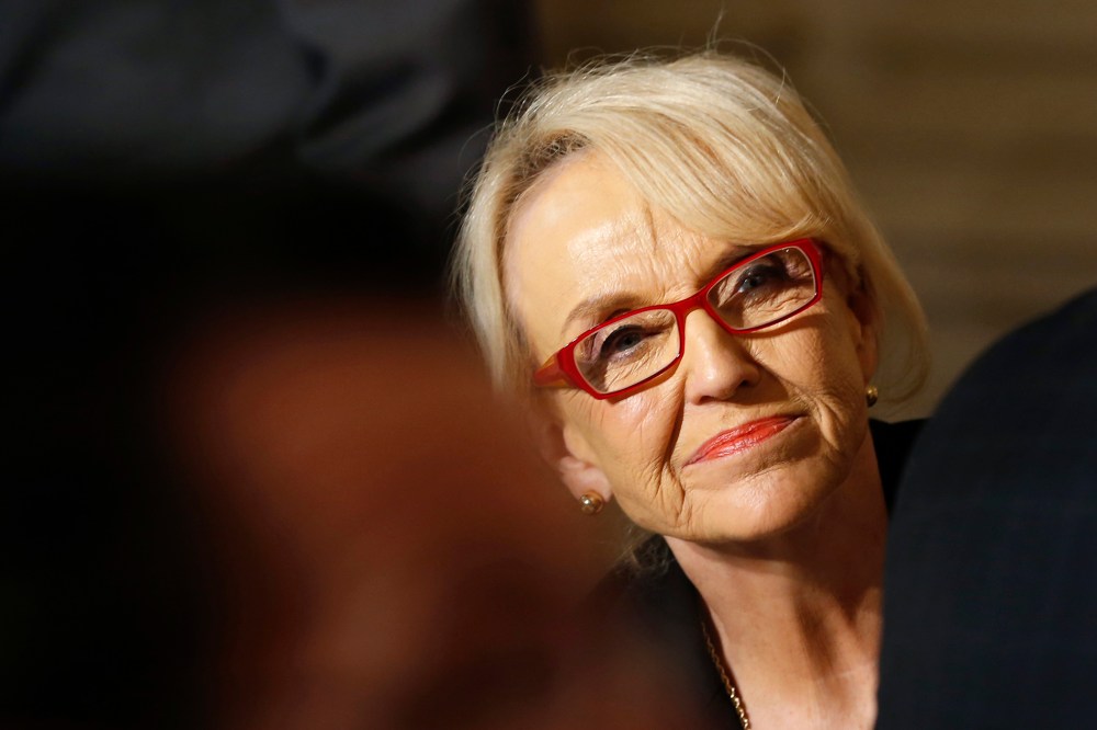 Arizona Governor Jan Brewer watches as U.S. President Barack Obama addresses the National Governors Association, Feb. 24, 2014.