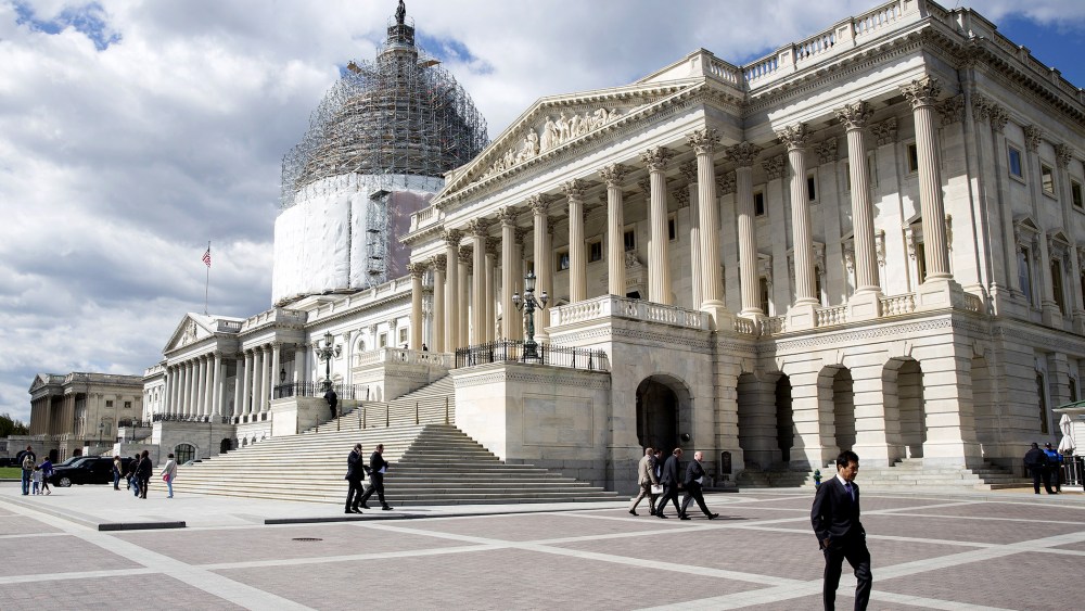 A man walks in front of the U.S. Capitol in Washington on April 23, 2015.