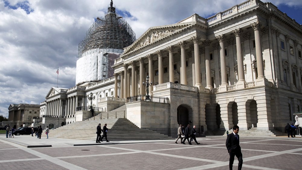 A man walks in front of the U.S. Capitol in Washington April 23, 2015. (Photo by Joshua Roberts/Reuters)