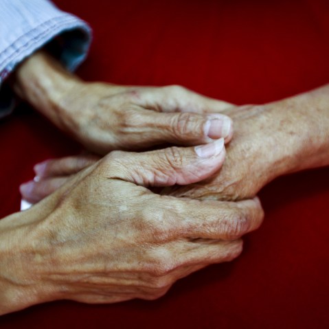 Rosa Elba Lacosta Sanchez Del Campo (L), 57, holds the hand of her mother Caridad Sanchez Del Campo Matos, 83, from Cuba, in La Galena, on the Spanish Canary island of Tenerife, Spain, April 1, 2015. (Photo by Santiago Ferrero/Reuters)
