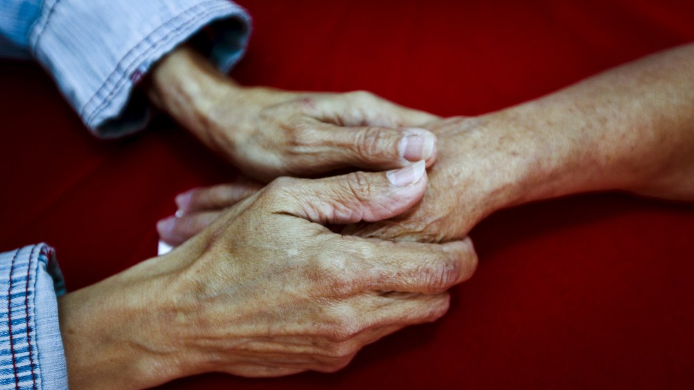 Rosa Elba Lacosta Sanchez Del Campo (L), 57, holds the hand of her mother Caridad Sanchez Del Campo Matos, 83, from Cuba, in La Galena, on the Spanish Canary island of Tenerife, Spain, April 1, 2015. (Photo by Santiago Ferrero/Reuters)