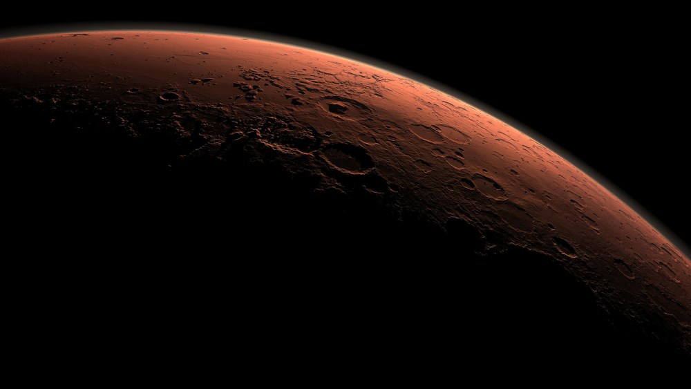 This computer-generated view depicts part of Mars at the boundary between darkness and daylight, with an area including Gale Crater beginning to catch morning light, in this handout image provided by NASA. (Photo by NASA/JPL-Caltech/Reuters)
