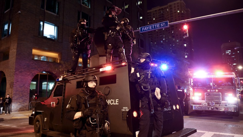 A police unit blocks the intersection of Guilford Avenue and Fayette Street near City Hall in Baltimore, May 1, 2015. (Photo by Sait Serkan Gurbuz/Reuters)