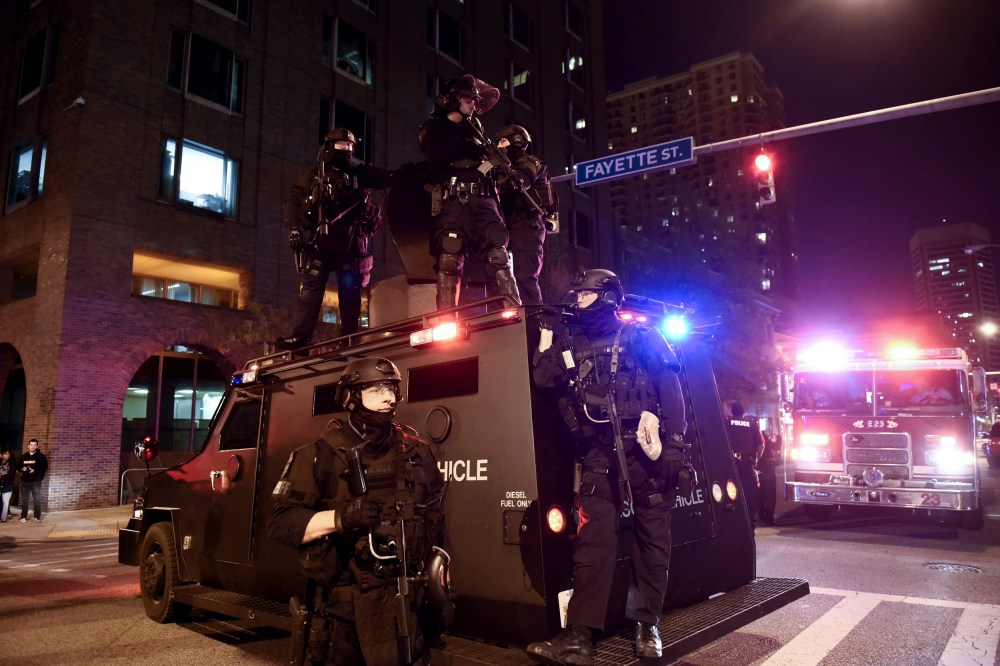 A police unit blocks the intersection of Guilford Avenue and Fayette Street near City Hall in Baltimore, May 1, 2015. (Photo by Sait Serkan Gurbuz/Reuters)