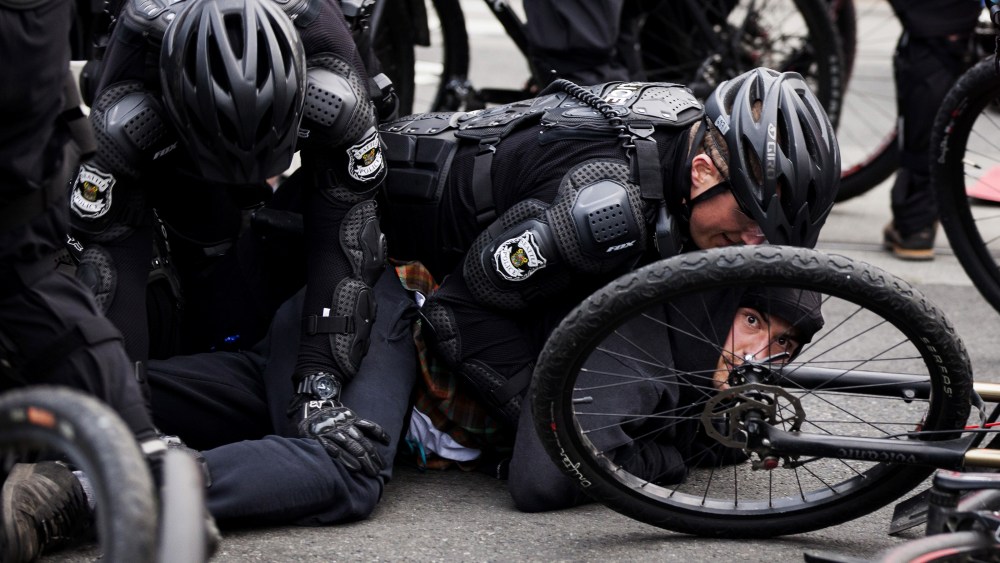Police detain a demonstrator during an anti-capitalist protest in Seattle, Wash., May 1, 2015. (Photo by David Ryder/Reuters)