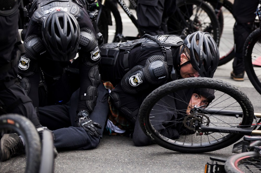 Police detain a demonstrator during an anti-capitalist protest in Seattle, Wash., May 1, 2015. (Photo by David Ryder/Reuters)