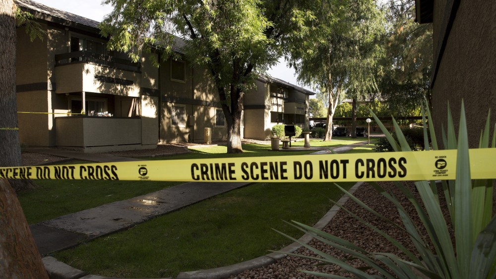 Crime scene tape surrounds buildings at the Autumn Ridge apartment complex which had been searched by investigators in Phoenix, Ariz., May 4, 2015. (Photo by Nancy Wiechec/Reuters)