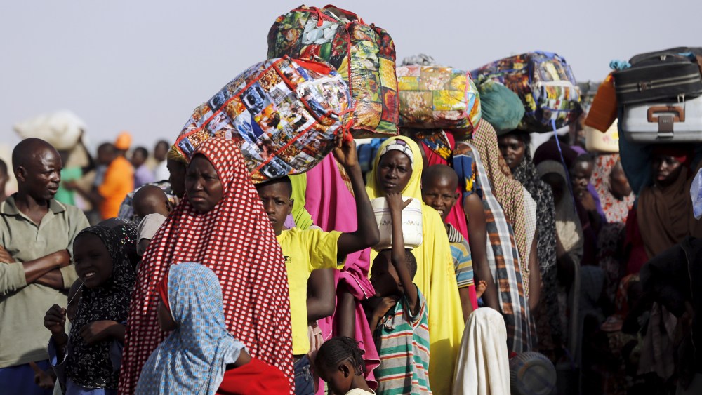 Returnees queue during the evacuation of Nigerians displaced by Boko Haram militants, at a camp for displaced people in Geidam, Yobe state, Nigeria, May 6, 2015. (Photo by Afolabi Sotunde/Reuters)