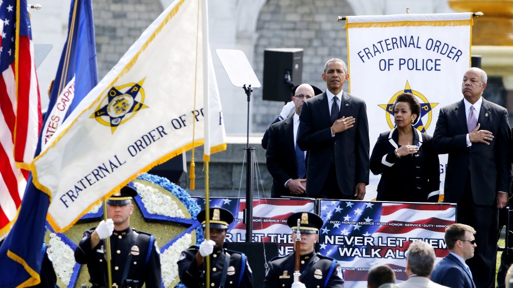 U.S. President Barack Obama, Attorney General Loretta Lynch and Homeland Security Secretary Jeh Johnson stand for the national anthem at the National Peace Officers' Memorial Service in Washington May 15, 2015. (Photo by Jonathan Ernst/Reuters)