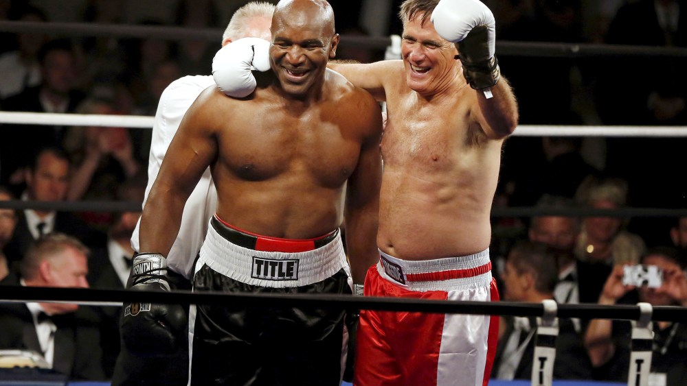Former Massachusetts Governor Mitt Romney and five-time heavyweight champion Evander Holyfield celebrate after their boxing match in Salt Lake City, Ut. on May 15, 2015. (Photo by Jim Urquhart/Reuters)