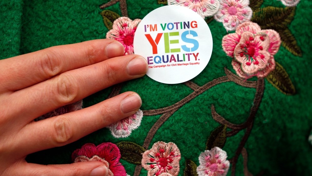 A Yes supporter shows her campaign badge in central Dublin, Ireland on May 21, 2015. (Photo by Cathal McNaughton/Reuters)