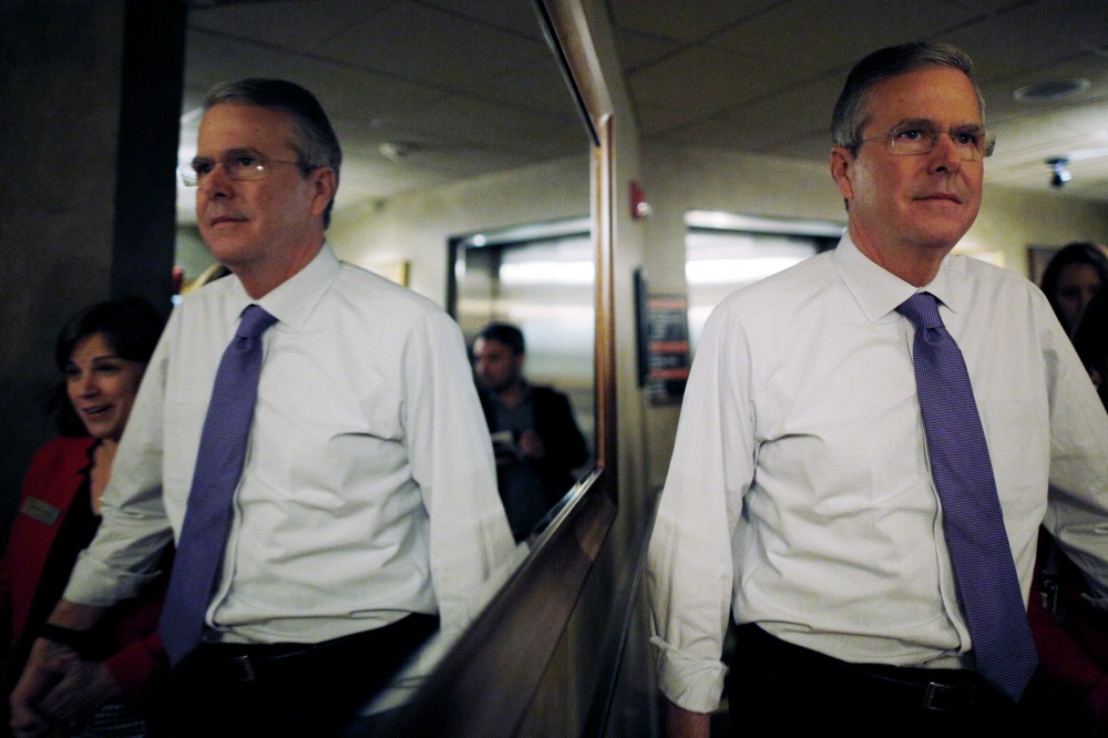 Potential 2016 Republican presidential candidate and former Florida Governor Jeb Bush is reflected in a mirror as he departs after speaking to the Greater Salem Chamber of Commerce in Salem, N.H. May 21, 2015. (Photo by Brian Snyder/Reuters)