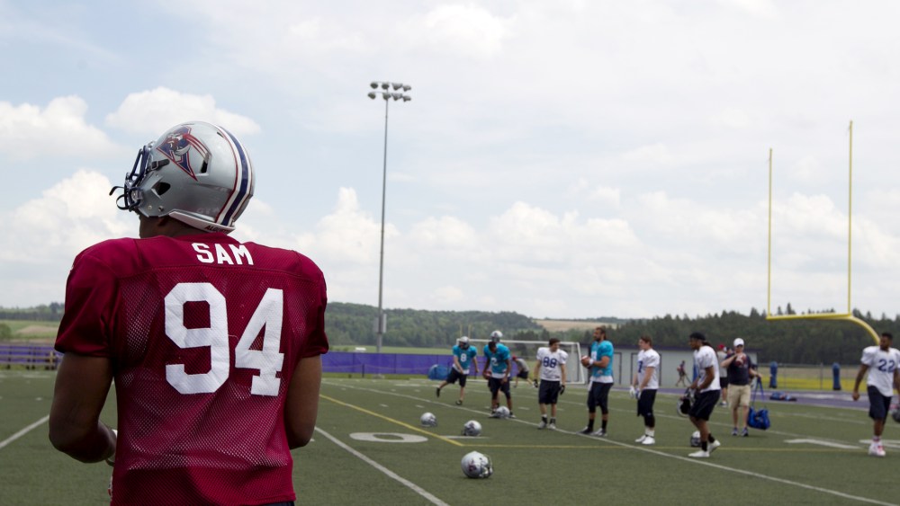 Michael Sam, newly signed defensive end for the Montreal Alouettes CFL football team, arrives on the field for rookie training camp in Sherbrooke, Quebec, May 27, 2015. (Photo by Christinne Muschi/Reuters)