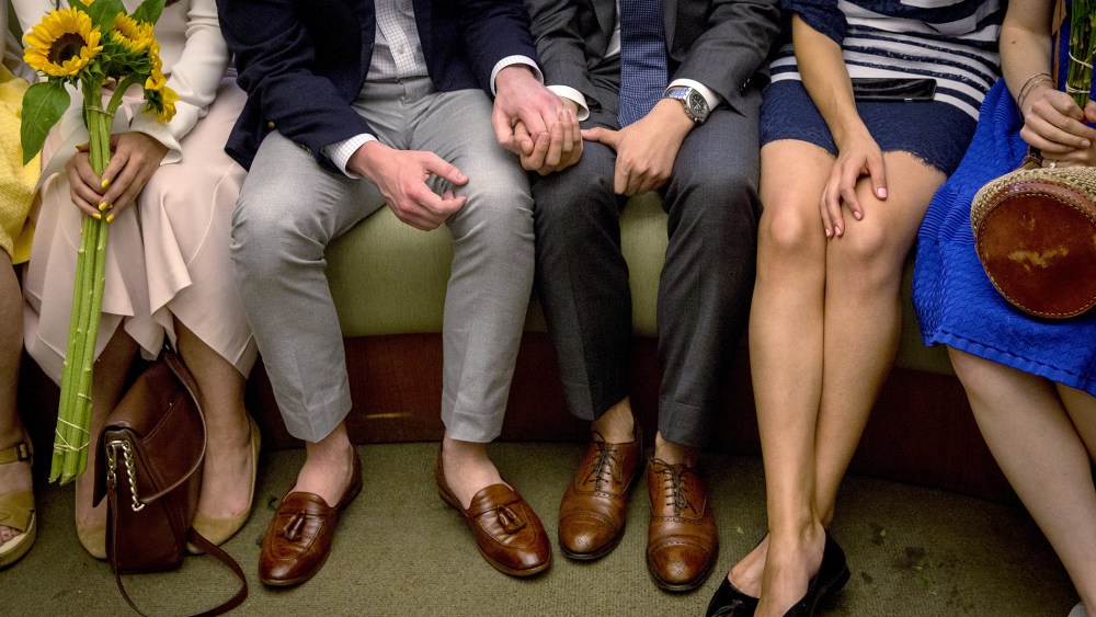 Ashby Hardesty (2nd L) and Rodrigo Zamora (C) hold hands as they wait with friends for their wedding ceremony at the New York City clerk's office in Manhattan, N.Y., June 26, 2015. (Photo by Brendan McDermid/Reuters)