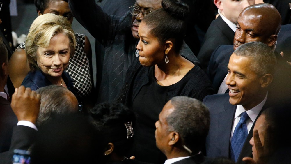 U.S. Democratic presidential candidate Hillary Clinton talks with first lady Michelle Obama and President Barack Obama after the conclusion of funeral services for Rev. Clementa Pinckney, Charleston, S.C., June 26, 2015. (Photo by Jonathan Ernst/Reuters)