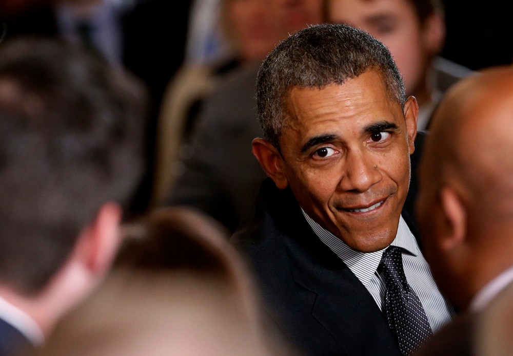 U.S. President Barack Obama greets attendees in the crowd after signing House Resolution 2146, the "Defending Public Safety Employees' Retirement Act and Trade Preference Extension Act of 2015," June 29, 2015. (Photo by Jonathan Ernst/Reuters)
