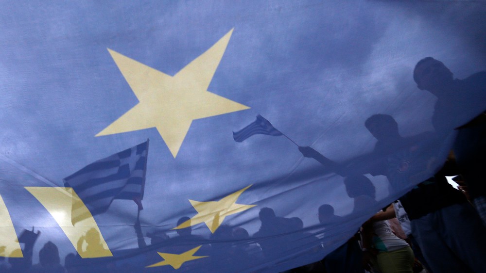 Pro-Euro protestors hold European Union flags during a pro-Euro rally in front of the parliament building in Athens, Greece on Jun. 30, 2015. (Photo by Yannis Behrakis/Reuters)
