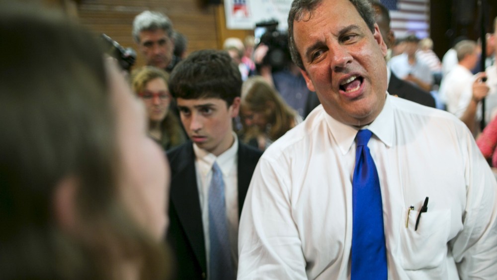 New Jersey governor and Republican presidential candidate Chris Christie speaks with supporters after a town hall event in Sandown