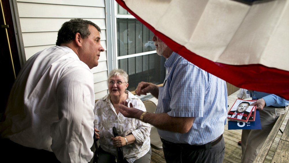 New Jersey governor and Republican presidential candidate Chris Christie speaks with supporters after a town hall event in Sandown