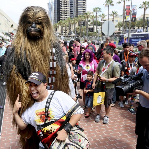 A man dressed as Chewbacca from Star Wars poses with fans outside of the 2015 Comic-Con International in San Diego, Calif. on July 9, 2015. (Photo by Sandy Huffaker/Reuters)