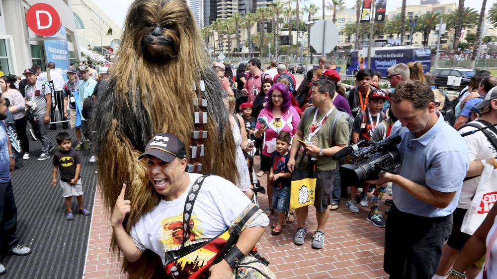 A man dressed as Chewbacca from Star Wars poses with fans outside of the 2015 Comic-Con International in San Diego, Calif. on July 9, 2015. (Photo by Sandy Huffaker/Reuters)