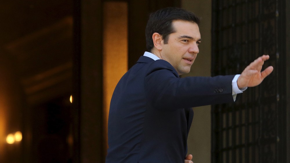Greek Prime Minister Alexis Tsipras arrives at his office at the Maximos Mansion after a swearing in ceremony of members of his government at the Presidential Palace in Athens, Greece July 18, 2015. (Photo by Yiannis Kourtoglou/Reuters)