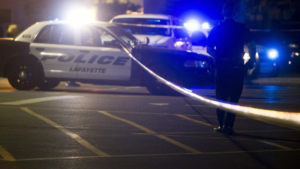 Police stand by at the scene outside the movie theatre where a man opened fire on film goers in Lafayette, La., July 23, 2015. (Photo by Lee Celano/Reuters)