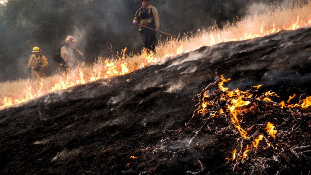 Firefighters work to dig a fire line on the Rocky Fire in Lake County, California July 30, 2015. The Rocky Fire broke out on Wednesday afternoon in Lake County, 110 miles (180 km) north of San Francisco. (Photo by Max Whittaker/Reuters)